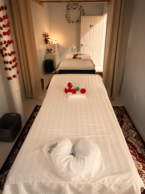 Couples massage room with two treatment beds