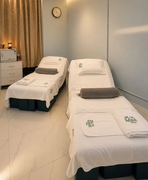 Foot massage room with two reclining treatment beds