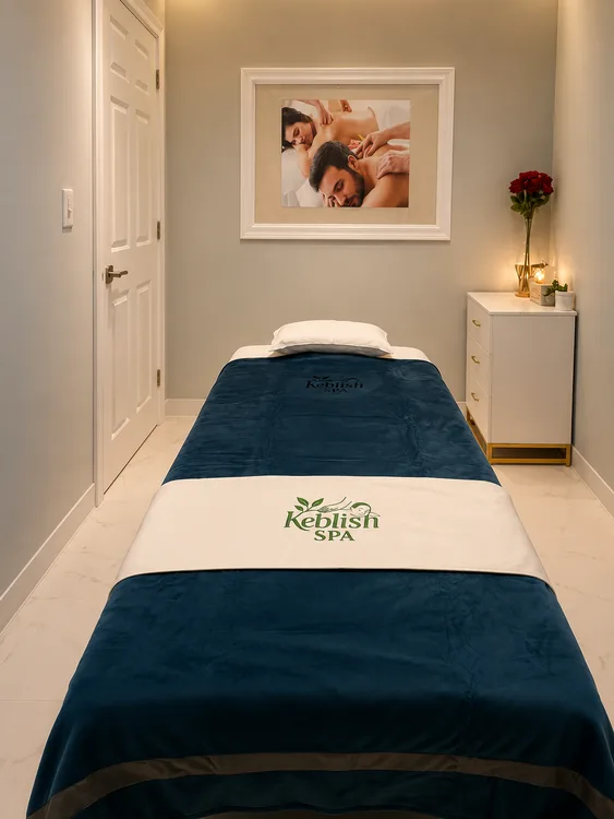 Private massage room with a single treatment bed